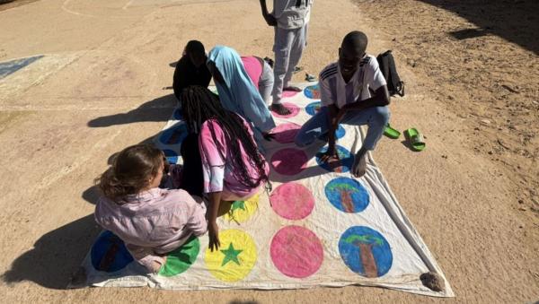 Playing twister with the lycée English club. We made a Senegal themed twister mat! Snowboarding